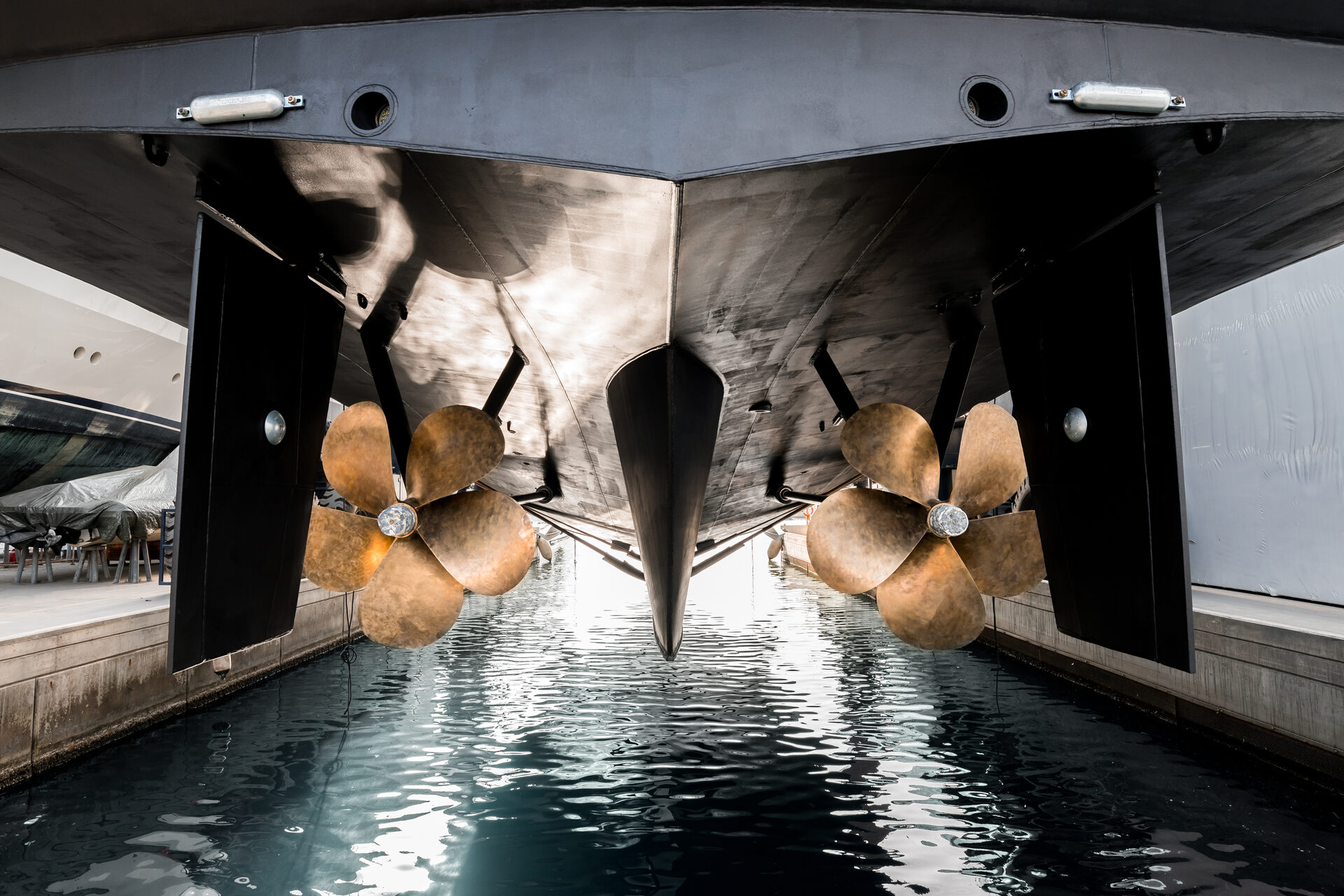 The underside of a yacht hull exposed during refit